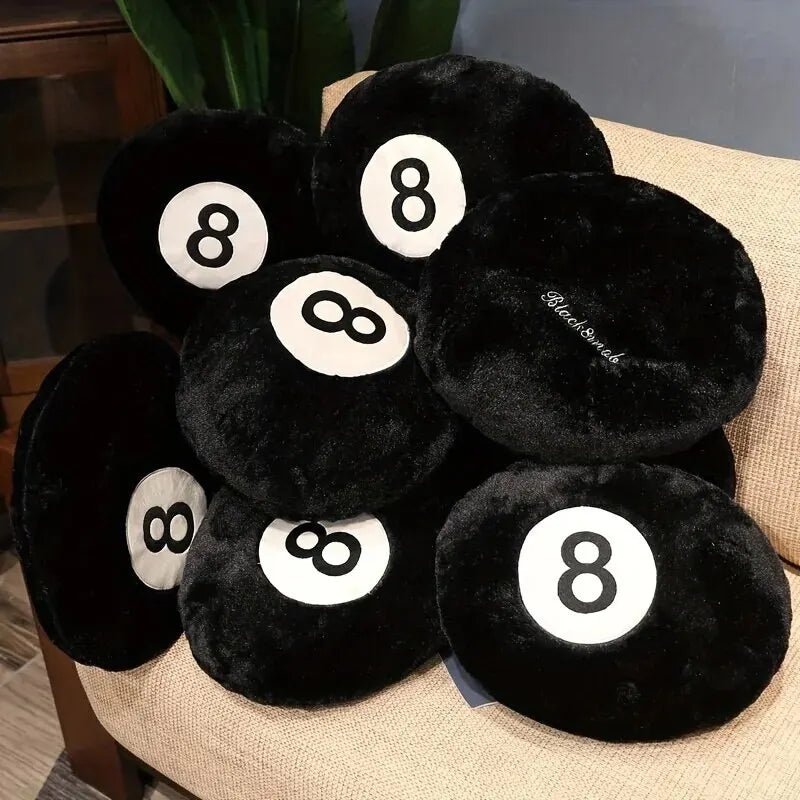Black 8 ball throw pillow on a modern sofa in a game room