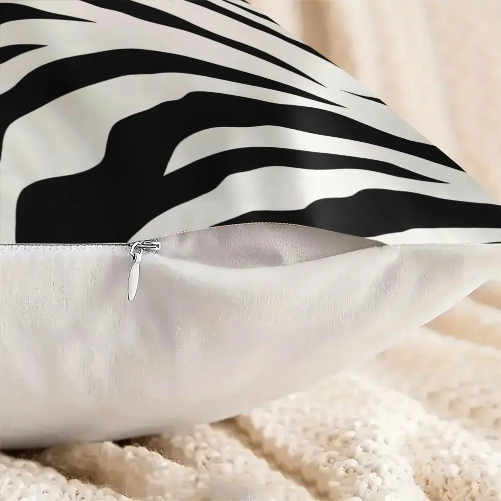 Black and white zebra print throw pillow on a modern sofa