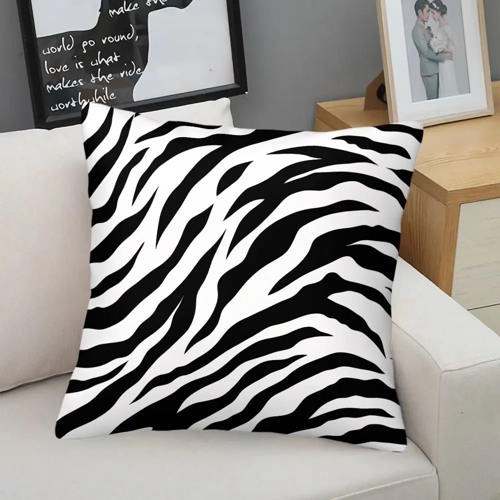 Black and white zebra print throw pillow on a modern sofa