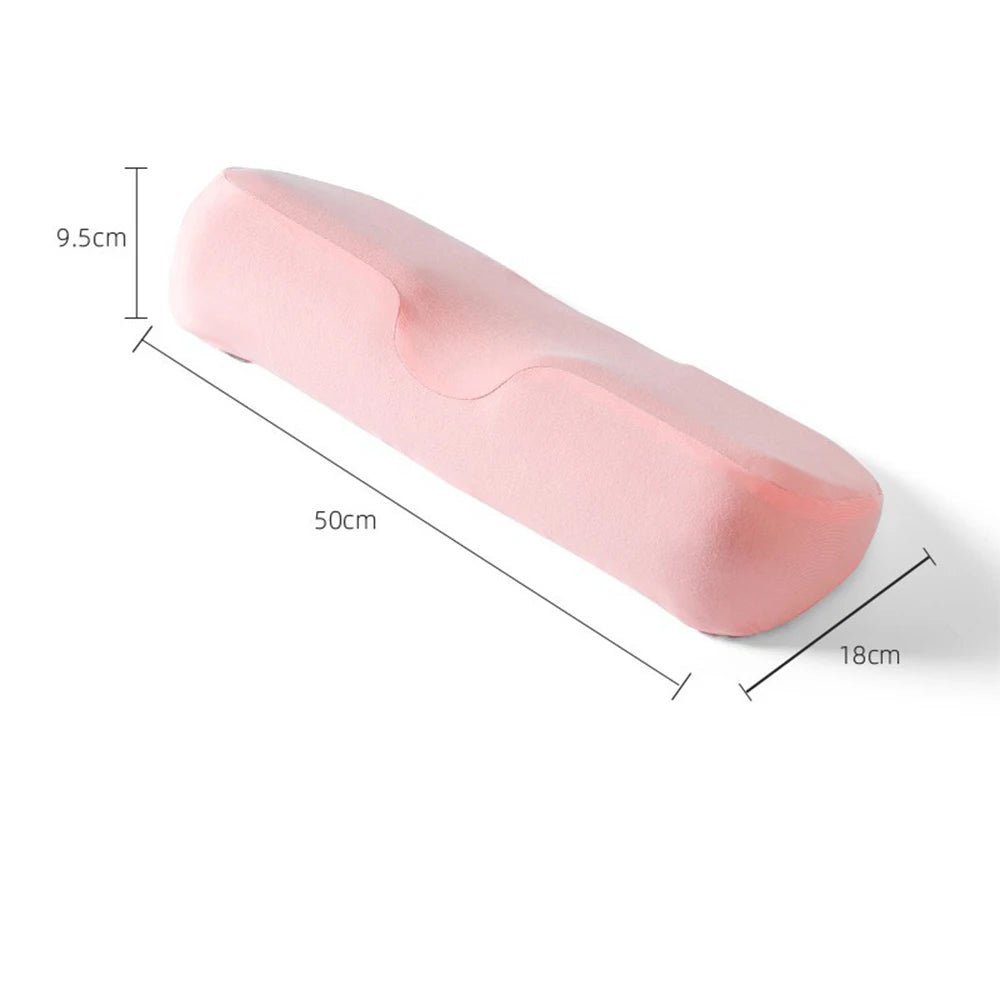Memory foam cervical contour pillow for side and back sleepers on a neatly made bed