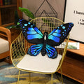 Colorful 3D butterfly throw pillow on a sofa as a decorative home accent cushion