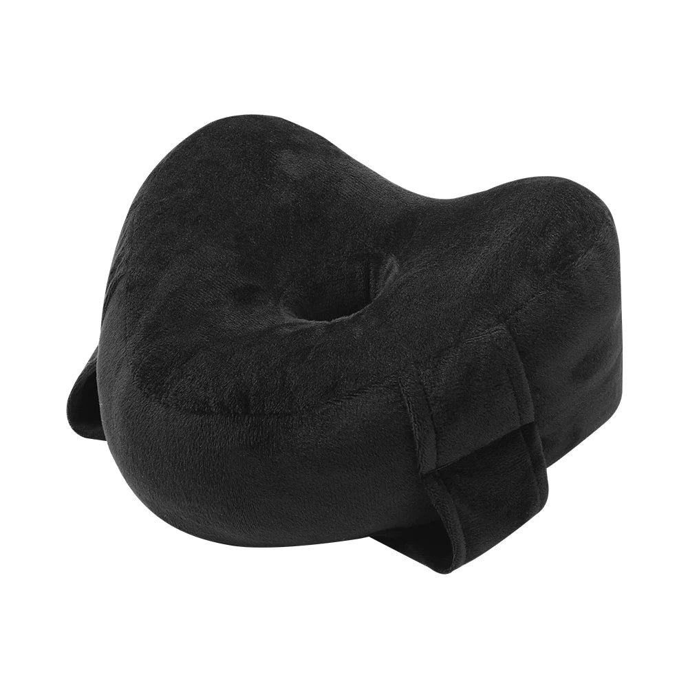 Memory foam orthopedic knee pillow placed between the legs of a side sleeper