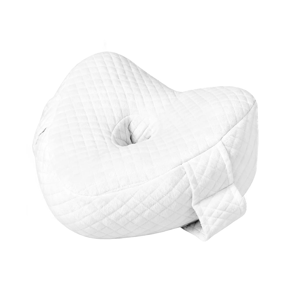 Memory foam orthopedic knee pillow placed between the legs of a side sleeper