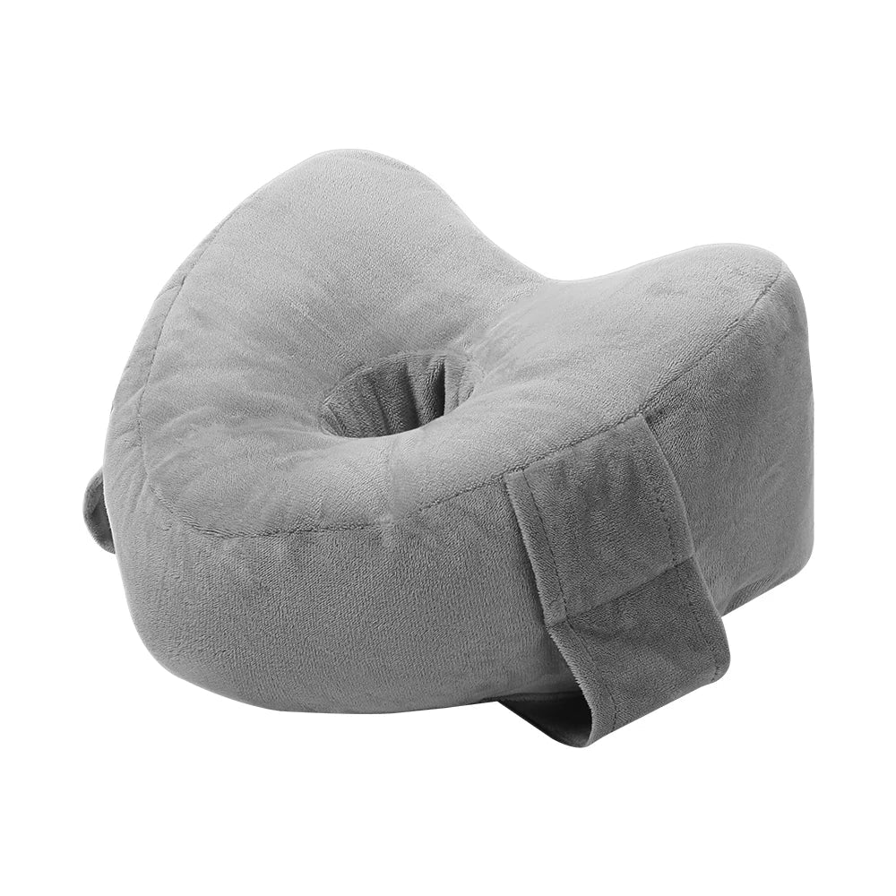 Memory foam orthopedic knee pillow placed between the legs of a side sleeper