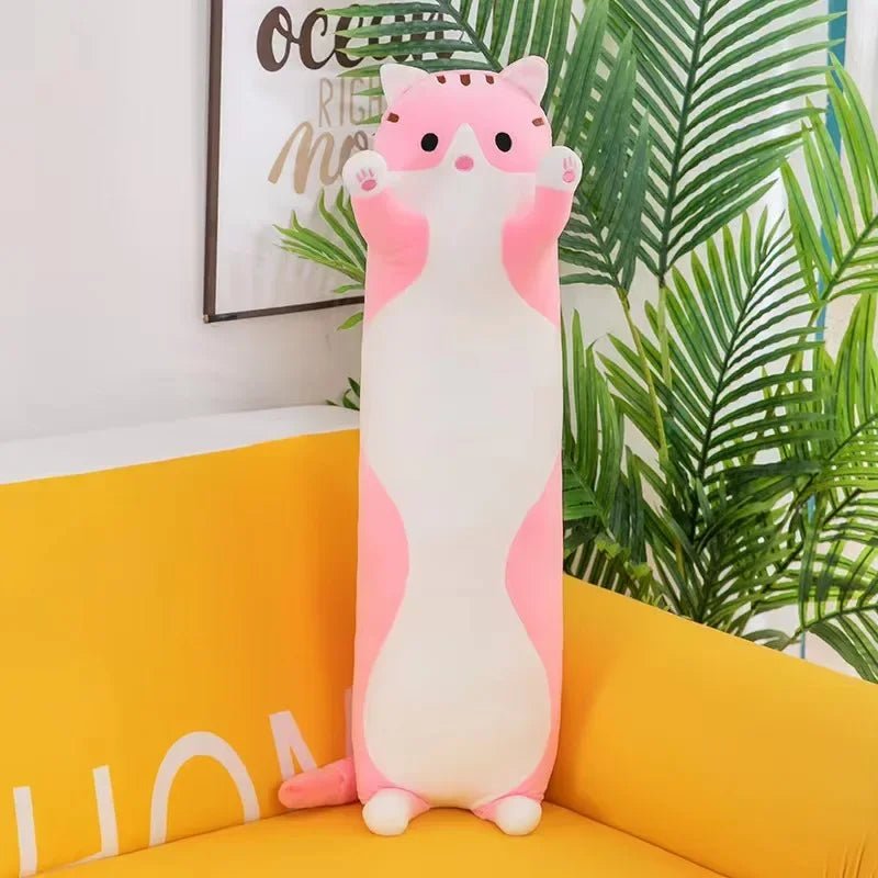 Long cat plush body pillow on a bed for cuddling and bedroom décor