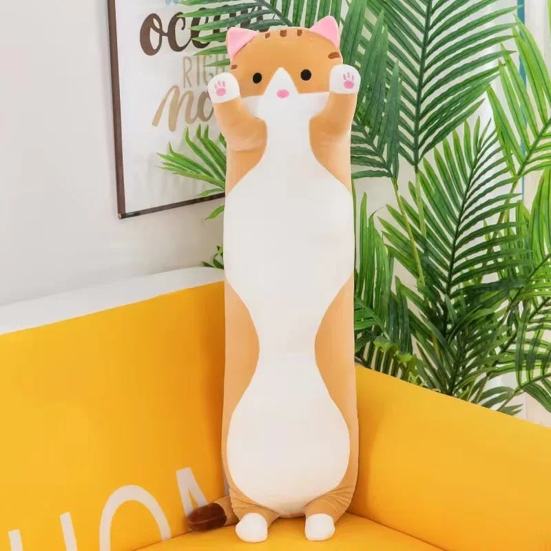 Long cat plush body pillow on a bed for cuddling and bedroom décor