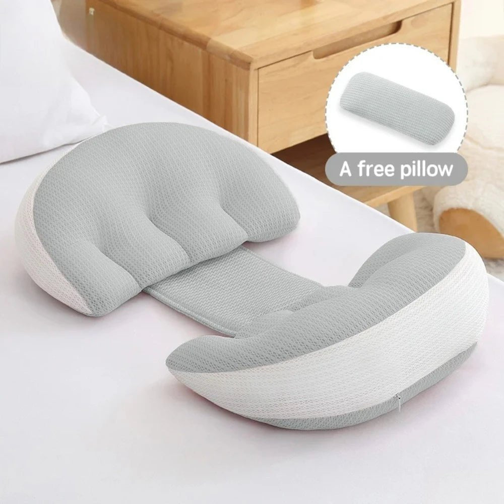 Full-body pregnancy pillow with free waist support pillow on a bed