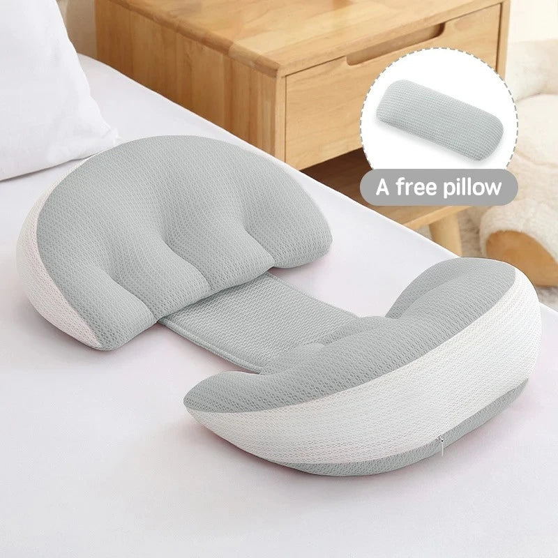Full-body pregnancy pillow with free waist support pillow on a bed