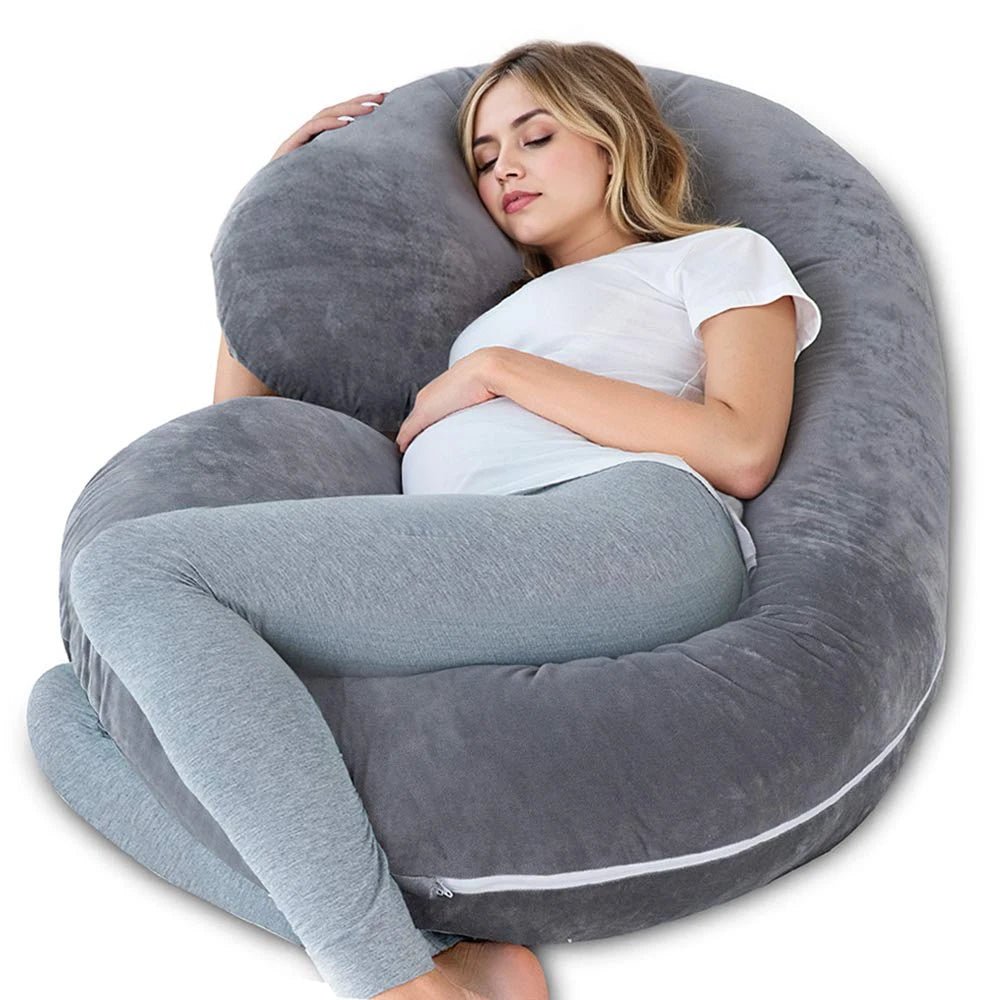G-shaped full body pregnancy pillow with removable cover on a neatly made bed