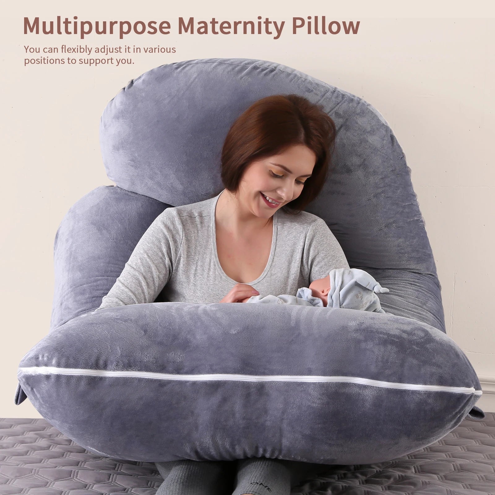 G-shaped full body pregnancy pillow with removable cover on a neatly made bed
