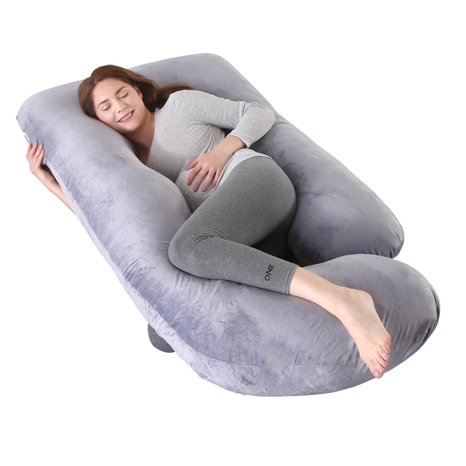 G-shaped full body pregnancy pillow with removable cover on a neatly made bed