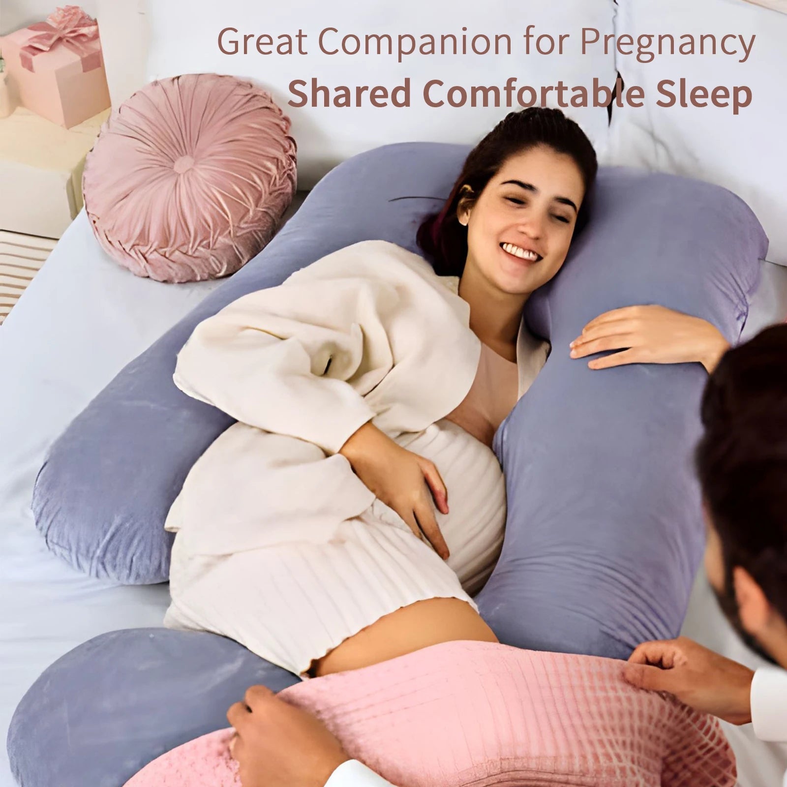 G-shaped full body pregnancy pillow with removable cover on a neatly made bed